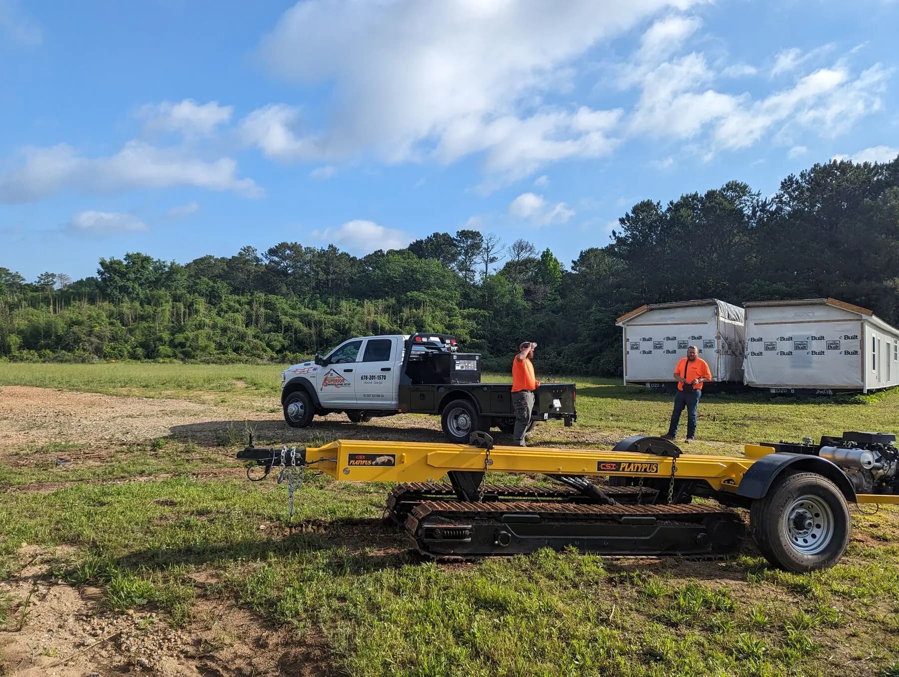 Crew preparing moving equipment on site.