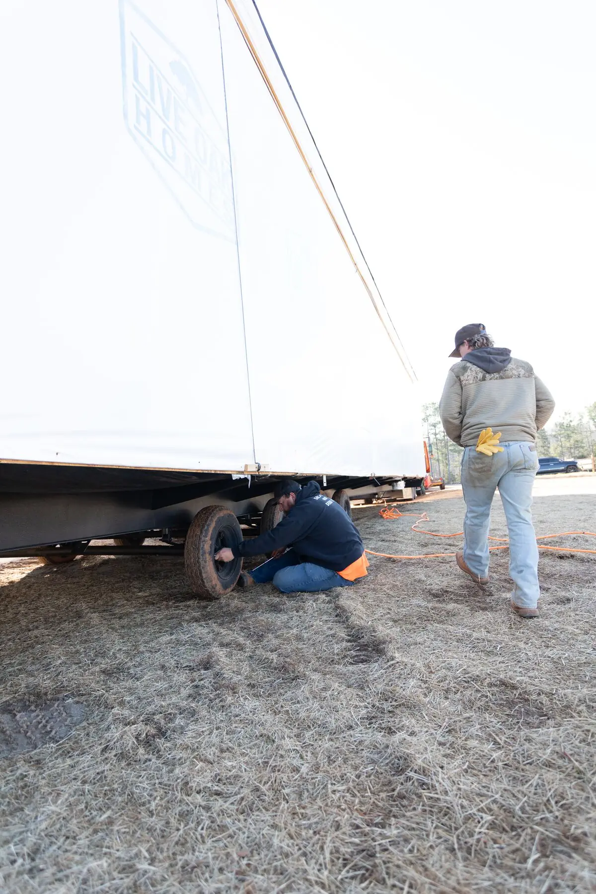 Crew servicing home axle.