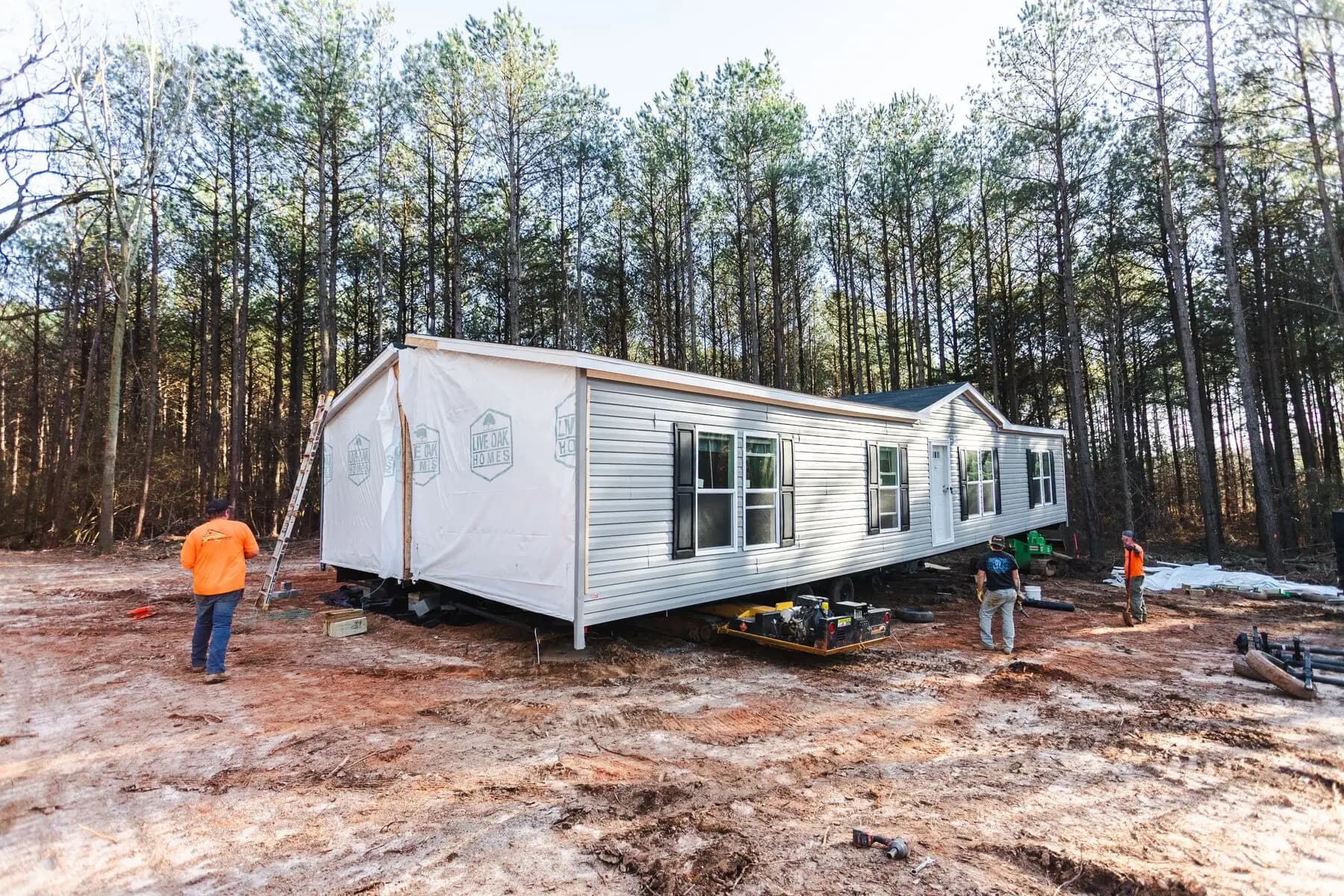 Crew working beside set home.