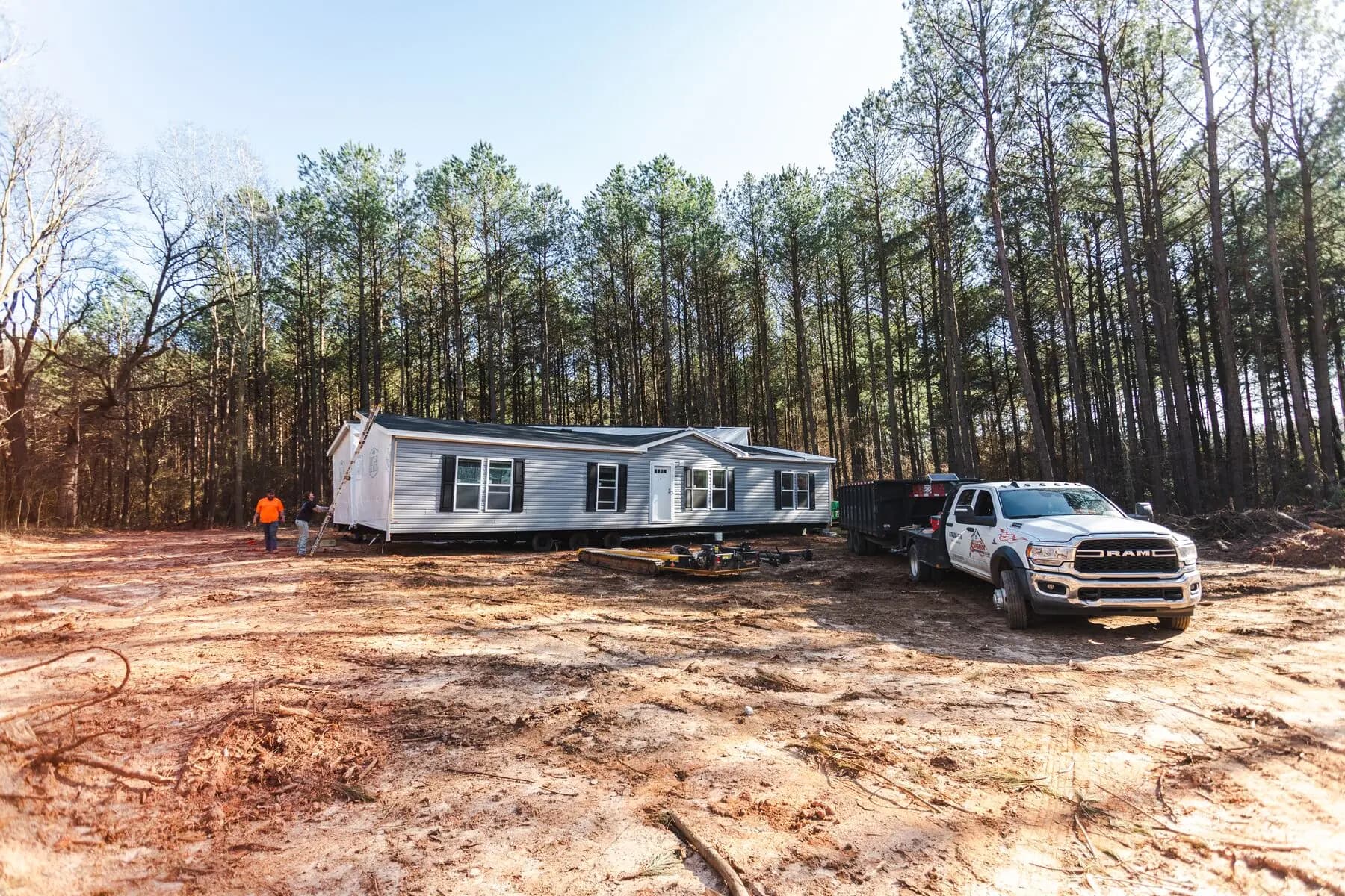 Double wide home set in wooded site.