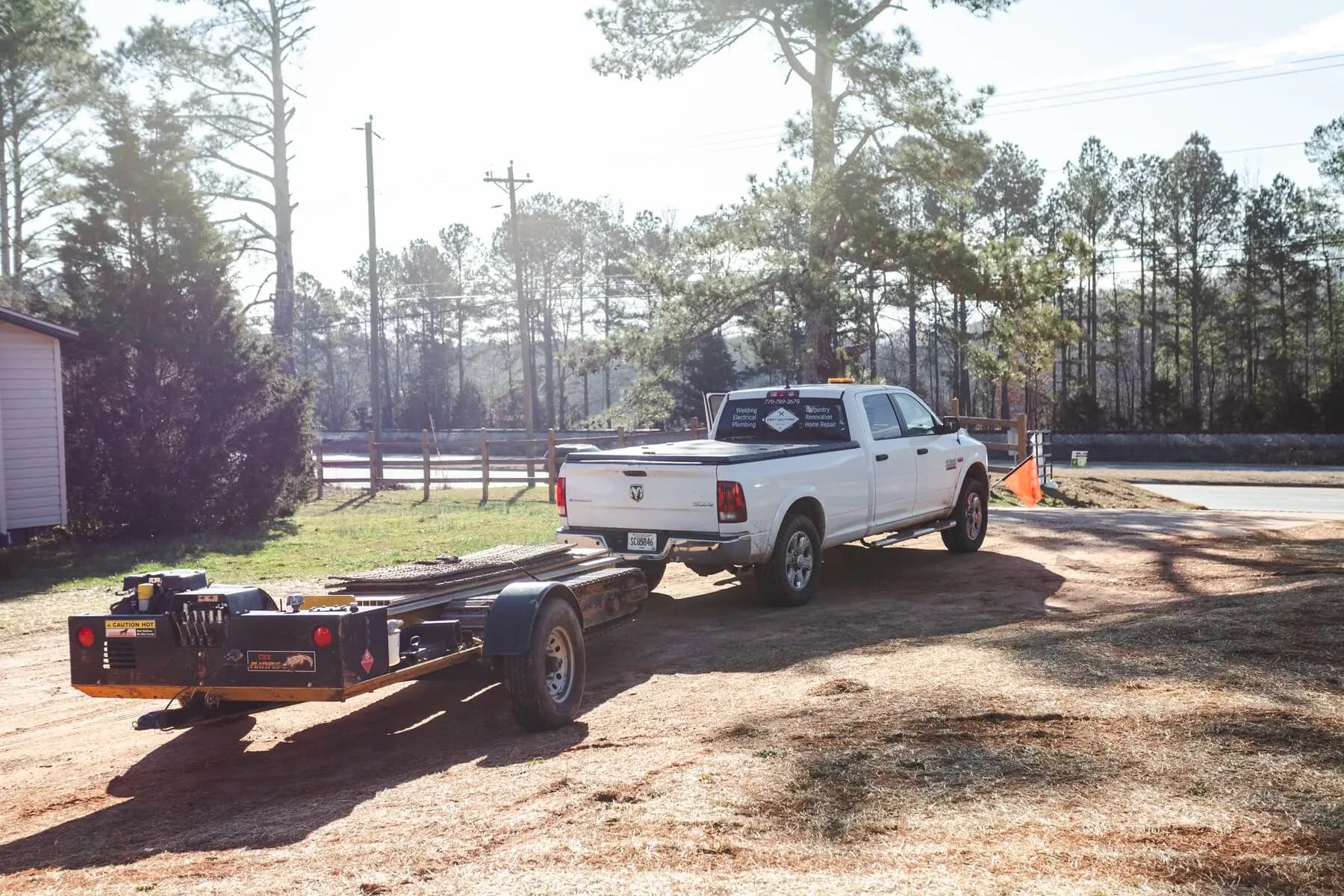 Escort pickup and equipment trailer.