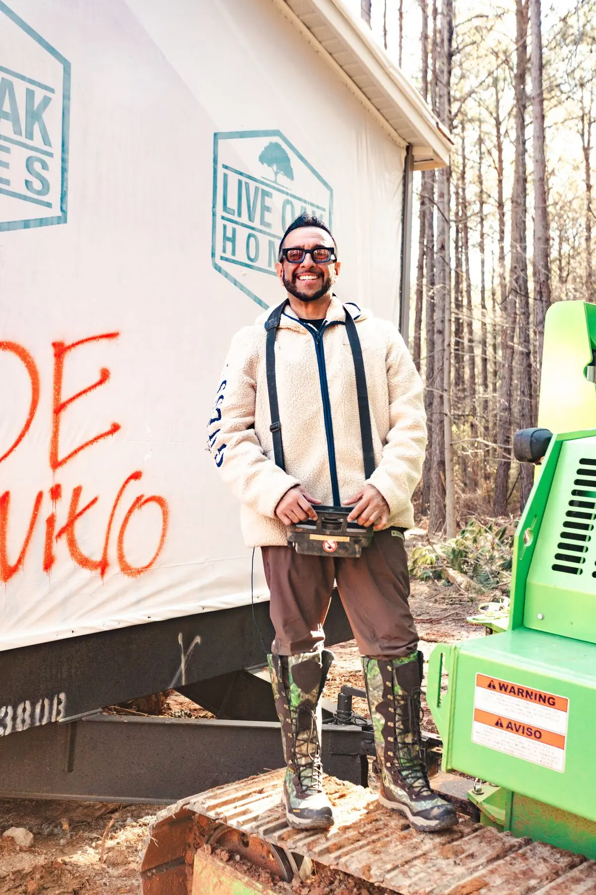 Field crew member beside house tug.