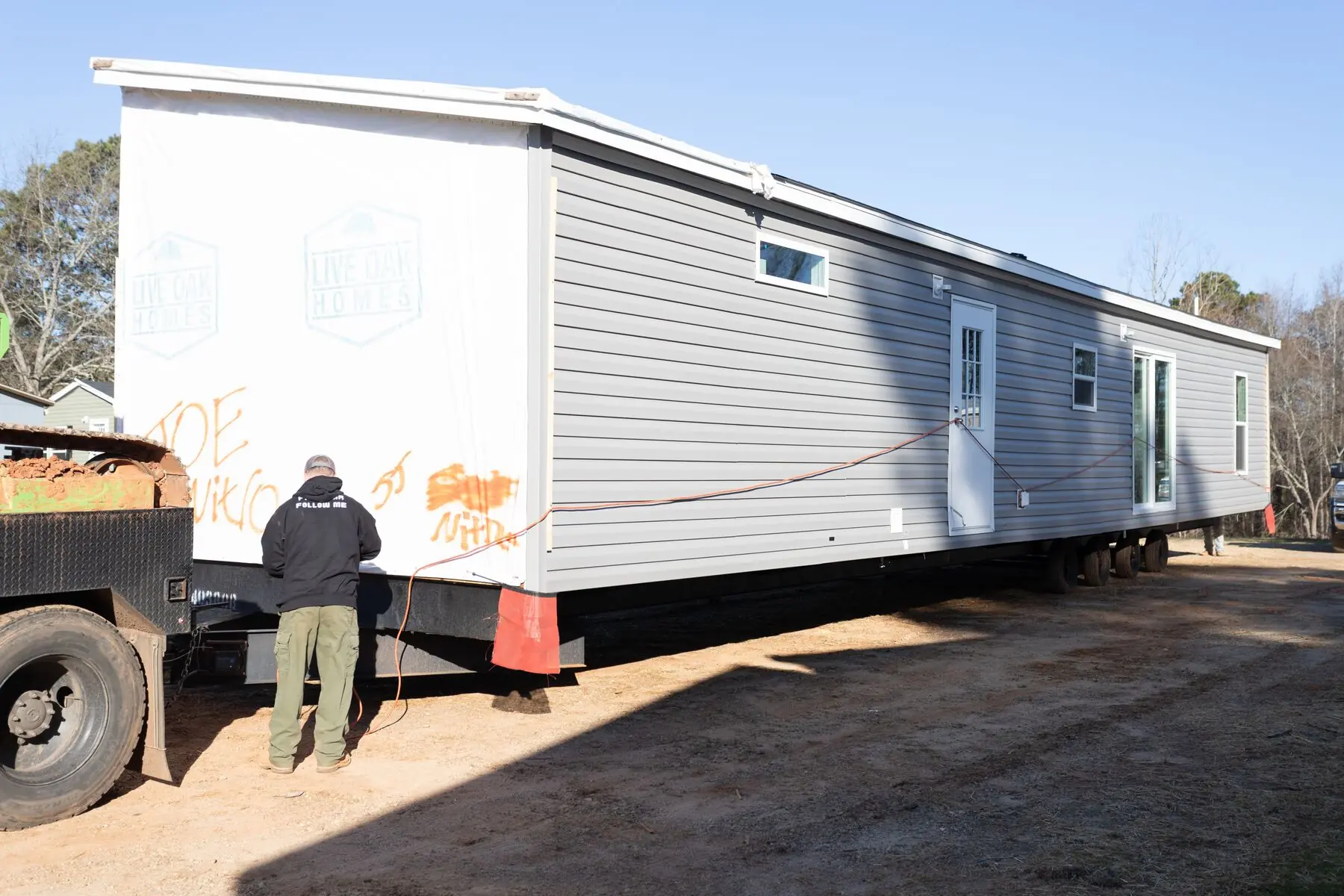 Orange truck moving home section.