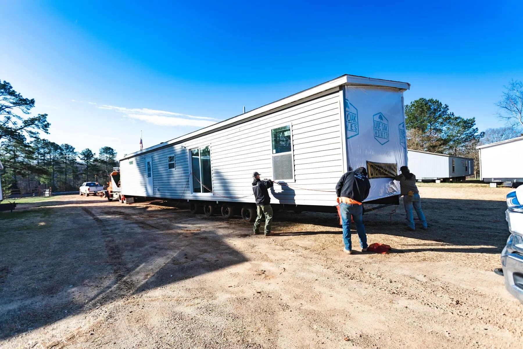 Positioning manufactured home section.