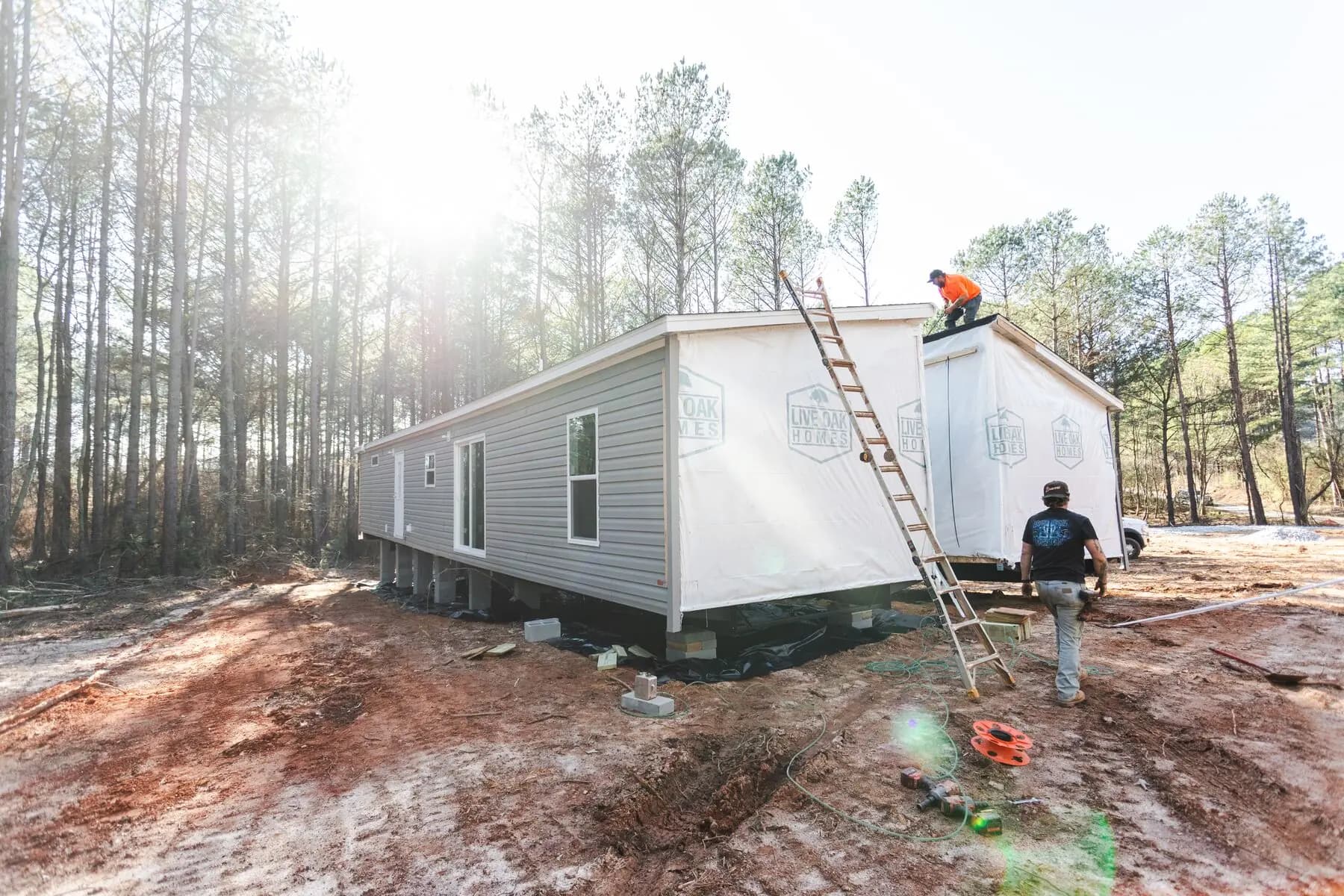 Roof crew finishing double wide.