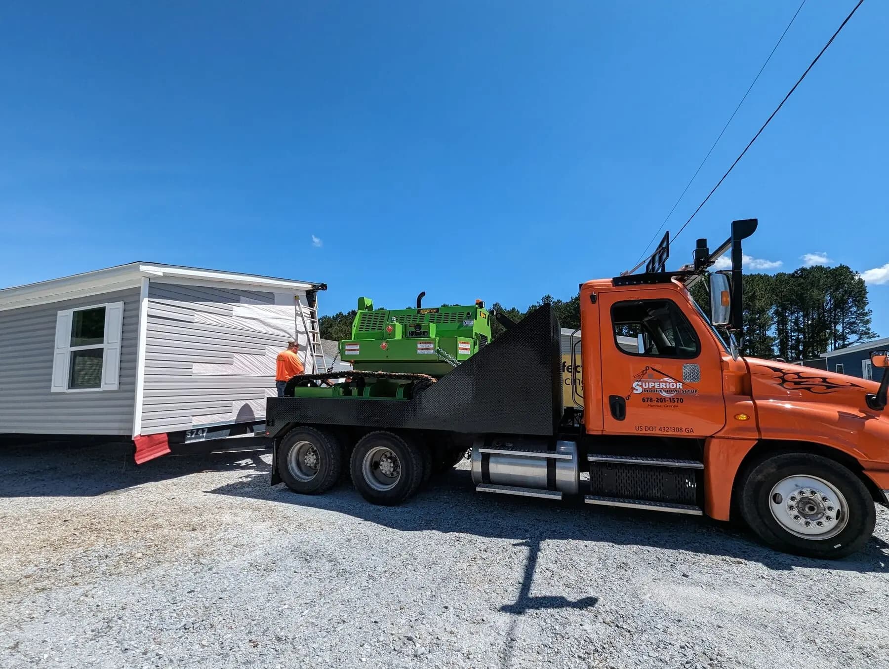 Superior orange truck moving home.