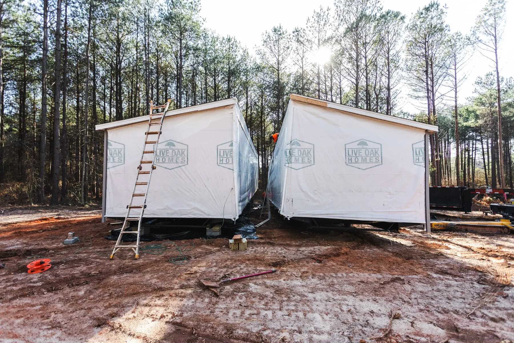 Worker between double wide sections.